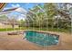 Secluded in-ground pool with screened enclosure and integrated hot tub for luxurious outdoor living at 2733 Deer Berry Ct, Longwood, FL 32779