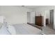 Cozy bedroom featuring a dresser and doorway leading to an ensuite bathroom at 2907 Moulin Rd, Davenport, FL 33837