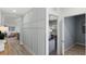 Neutral hallway with decorative accent wall that leads to a bedroom and other parts of the home at 2907 Moulin Rd, Davenport, FL 33837