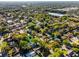 A beautiful aerial view showing neighborhood, mature trees, and lake at 2952 Ashwood Ct, Apopka, FL 32703