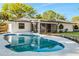 Inviting backyard pool featuring a screened lanai and meticulously maintained landscaping at 2952 Ashwood Ct, Apopka, FL 32703