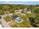 Aerial view of the property showcasing the pool, outdoor bar, spacious yard, and the surrounding neighborhood at 337 Ohio Ave, St Cloud, FL 34769