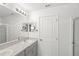 Bathroom featuring a double sink vanity with a walk-in shower at 3936 Fescue St, Clermont, FL 34714