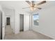 Cozy bedroom features carpet, ceiling fan and closet with sliding doors at 3936 Fescue St, Clermont, FL 34714