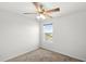 Bright bedroom with a ceiling fan and a large window at 3936 Fescue St, Clermont, FL 34714