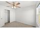 Bedroom features ceiling fan, closet, and natural light at 3936 Fescue St, Clermont, FL 34714