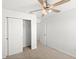 Bedroom features ceiling fan, closet, and neutral carpeting at 3936 Fescue St, Clermont, FL 34714