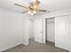 Bedroom features ceiling fan, closet, and neutral carpeting at 3936 Fescue St, Clermont, FL 34714