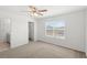 Bedroom featuring neutral walls, a window for light, and a ceiling fan at 3936 Fescue St, Clermont, FL 34714