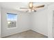 Bedroom with ceiling fan, carpet, and window at 3936 Fescue St, Clermont, FL 34714