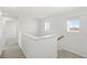 Bright hallway with white walls, carpet flooring, and natural light at 3936 Fescue St, Clermont, FL 34714