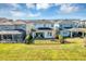 Aerial view of backyard with patio, lawn, and fence in residential neighborhood at 3964 Lightning Ct, Sanford, FL 32773