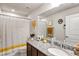 Well-lit bathroom featuring granite countertop, framed mirror, and neutral color scheme at 3964 Lightning Ct, Sanford, FL 32773