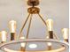 Close-up of a modern chandelier lighting fixture with Edison-style bulbs and a white round frame at 3964 Lightning Ct, Sanford, FL 32773