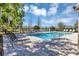 Sparkling community pool with lounge chairs, perfect for relaxing and enjoying the sunny outdoors at 3964 Lightning Ct, Sanford, FL 32773