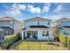 Birds eye view of the backyard featuring a covered patio, manicured lawn, and basketball hoop at 3964 Lightning Ct, Sanford, FL 32773