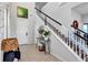 Bright foyer with staircase, tile flooring, and stylish decor creating an inviting entrance at 3964 Lightning Ct, Sanford, FL 32773