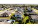 Areal backyard view showcasing a screened in pool and landscaped yard at 420 Lone Heron Way, Winter Garden, FL 34787