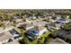 Aerial backyard view featuring a screened in pool and well-maintained lawn at 420 Lone Heron Way, Winter Garden, FL 34787