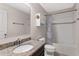 Full bathroom with granite countertop, tub, and shower featuring white subway tile and a shower curtain at 420 Lone Heron Way, Winter Garden, FL 34787