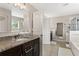 Open-concept bathroom with granite countertop, divided vanities, and tiled flooring at 420 Lone Heron Way, Winter Garden, FL 34787