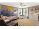 bedroom with decorative wall art, neutral carpet, and white trim with lots of natural light at 420 Lone Heron Way, Winter Garden, FL 34787