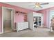 Pink bedroom with a loft bed, natural light, and neutral carpet creating a bright and inviting space at 420 Lone Heron Way, Winter Garden, FL 34787