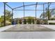 Backyard fountain surrounded by green vegetation and seating area for a relaxing atmosphere at 420 Lone Heron Way, Winter Garden, FL 34787