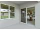 A view from a covered patio looking into the house with a sliding glass door at 420 Taylor Groves Dr, Lake Wales, FL 33898