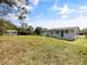 Spacious backyard with a storage shed and a well-maintained lawn at 46 Morning Glory Dr, Debary, FL 32713