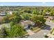 Aerial view of home showing mature trees, long driveway, and well-kept lawns at 520 Balsawood Ct, Altamonte Springs, FL 32714