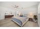 Bright bedroom with ceiling fan, neutral paint, and a view to the ensuite bathroom at 520 Balsawood Ct, Altamonte Springs, FL 32714