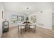 A cozy dining room with modern chandelier and natural lighting from the window at 520 Balsawood Ct, Altamonte Springs, FL 32714