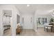 Bright entryway with decorative front door and wood-look flooring adjacent to bedroom and dining area at 520 Balsawood Ct, Altamonte Springs, FL 32714