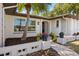 Inviting front entrance with a blue door, stone accents, and lush landscaping at 520 Balsawood Ct, Altamonte Springs, FL 32714