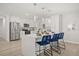 Modern kitchen with stainless steel appliances, white cabinets, and a quartz island with seating at 520 Balsawood Ct, Altamonte Springs, FL 32714