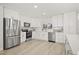 Bright white kitchen featuring stainless steel appliances and modern finishes at 520 Balsawood Ct, Altamonte Springs, FL 32714