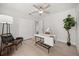 A serene office space features a ceiling fan, a modern desk, and a comfortable chair at 520 Balsawood Ct, Altamonte Springs, FL 32714