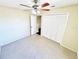 Neutral bedroom features plush carpet, a ceiling fan, closet, and adjacent bathroom at 527 Huxford Ct, Lake Mary, FL 32746