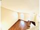 Bright living room features wood-look floors, natural light, and a staircase leading to the second floor at 527 Huxford Ct, Lake Mary, FL 32746