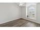 Inviting bedroom features a vaulted ceiling, ceiling fan, new floors and a large window at 5600 Revelwood Loop, Winter Park, FL 32792