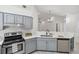 Well-appointed kitchen with stylish countertops and convenient breakfast bar seating at 5600 Revelwood Loop, Winter Park, FL 32792