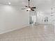 Bright, open living space featuring tiled flooring and a modern ceiling fan at 5600 Revelwood Loop, Winter Park, FL 32792