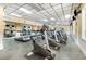 Well-equipped gym featuring treadmills, stationary bikes, and floor mats with plenty of natural light at 6412 Queens Borough Ave # 215, Orlando, FL 32835