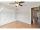 A bedroom with double closets and a ceiling fan at 7417 Wynnewood Sq # 174, Winter Park, FL 32792