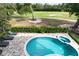 Backyard featuring a pool and hot tub with an amazing golf course view at 7419 Gathering Ct, Reunion, FL 34747