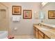 Bathroom featuring a single sink vanity, and framed art at 7419 Gathering Ct, Reunion, FL 34747