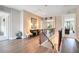 Upstairs landing featuring wood floors, iron railing, comfortable seating, and natural light at 7419 Gathering Ct, Reunion, FL 34747