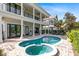 Stunning pool and spa area with a covered patio and ample seating space, perfect for outdoor entertaining at 7419 Gathering Ct, Reunion, FL 34747