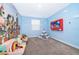 Vibrant ' playroom with custom wall mural and playful accents at 830 Sticks, Davenport, FL 33896